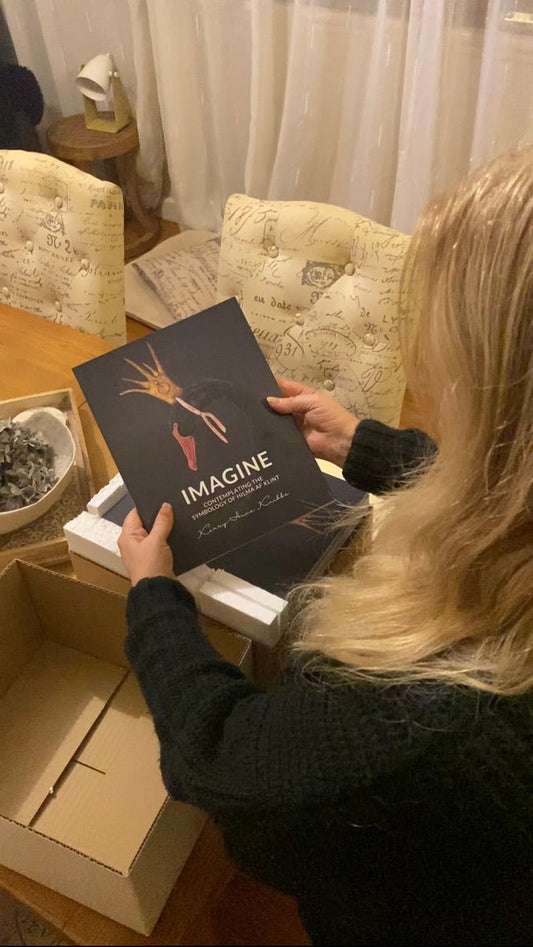 Kerry-Anne Knibbs unboxing the first print run of IMAGINE: Contemplating the Symbology of Hilma af Klint, celebrating the arrival of her debut book.