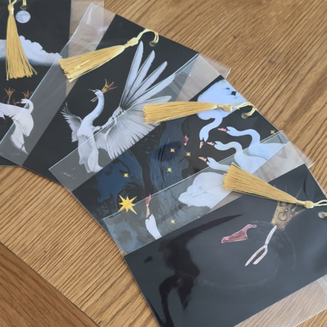 Decorative paper with artistic designs on a wooden surface